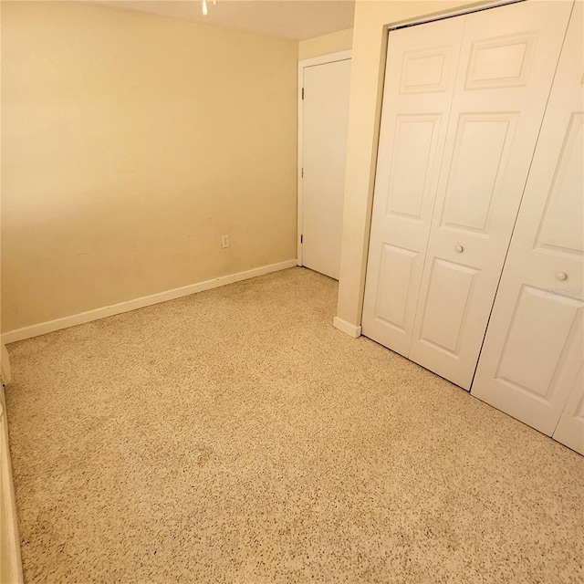 unfurnished bedroom featuring a closet