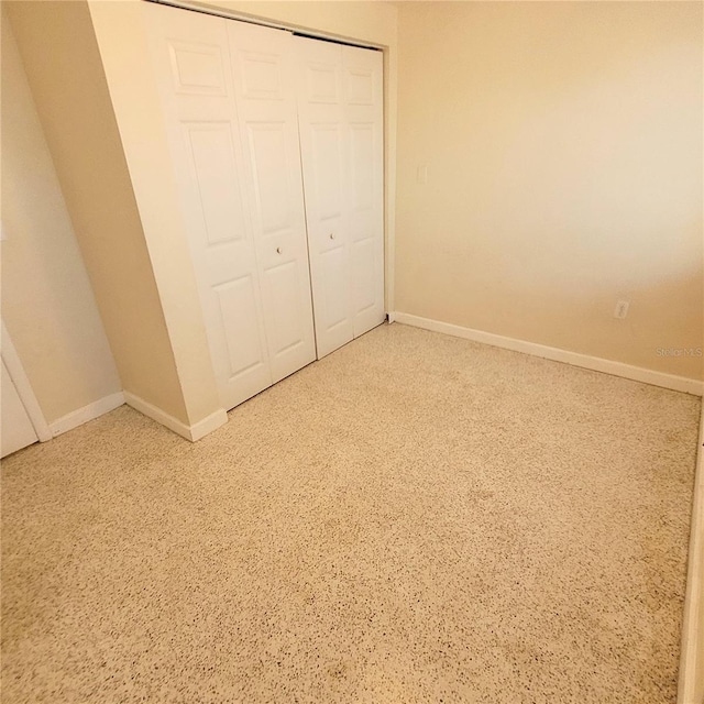 unfurnished bedroom with a closet