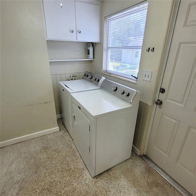 laundry room with cabinets and separate washer and dryer