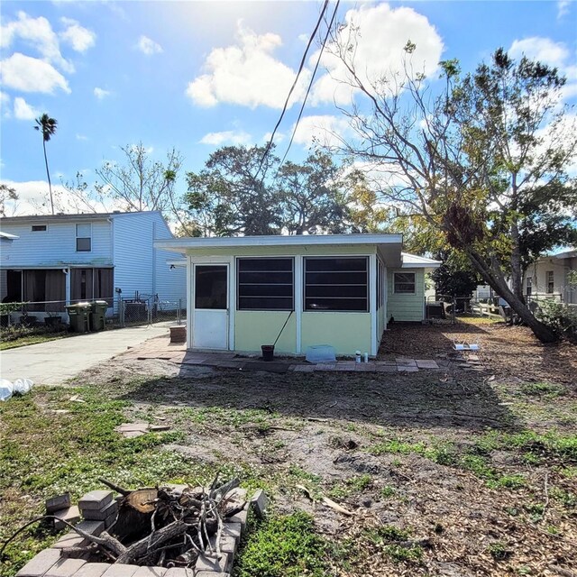 view of outbuilding with a fire pit