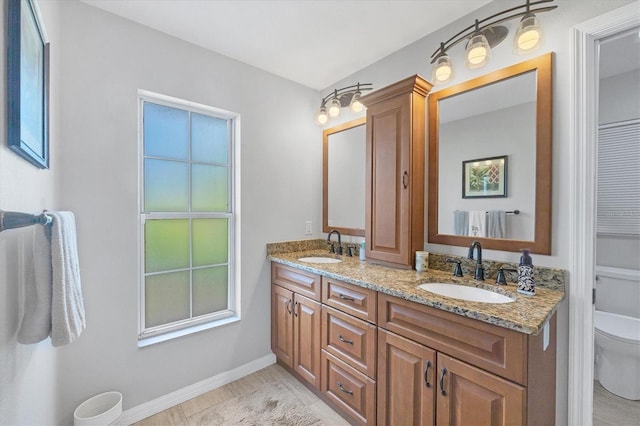 bathroom with vanity and toilet