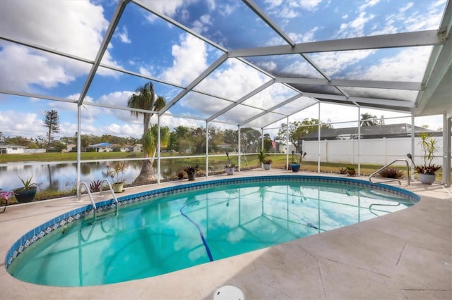 view of swimming pool featuring a lanai, a patio area, and a water view