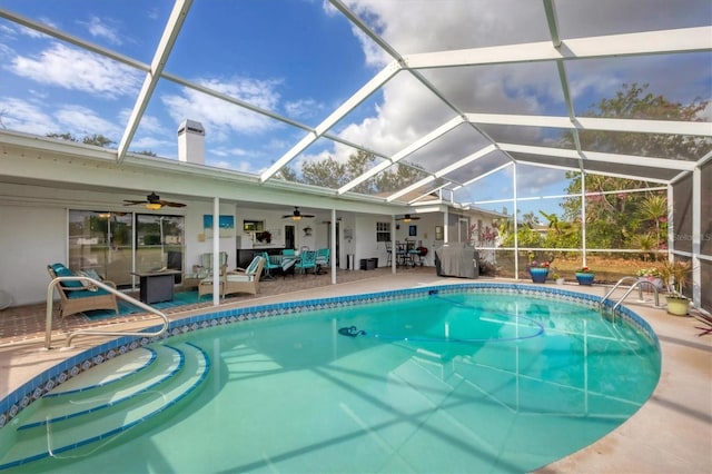 view of swimming pool featuring outdoor lounge area, a lanai, area for grilling, and a patio area