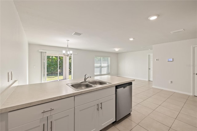 kitchen featuring white cabinets, sink, pendant lighting, dishwasher, and light tile patterned flooring