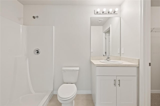 bathroom featuring tile patterned floors, vanity, toilet, and a shower