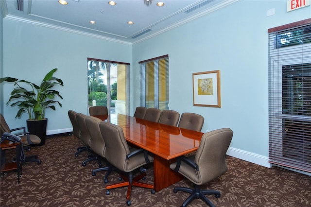 office area with ornamental molding and dark carpet