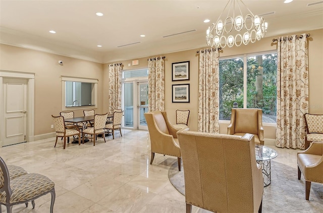 sitting room featuring crown molding and a notable chandelier