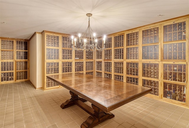 wine cellar with tile patterned flooring and a notable chandelier