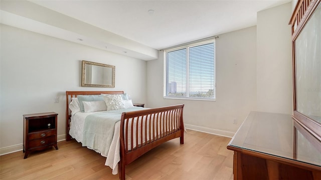 bedroom with light hardwood / wood-style floors