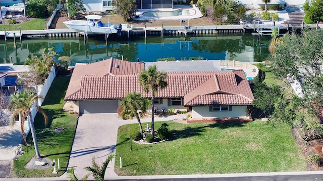 birds eye view of property with a water view