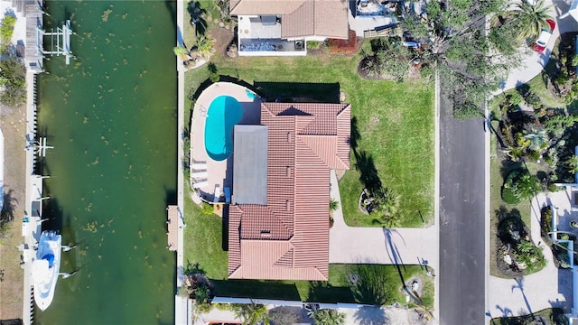 birds eye view of property featuring a water view