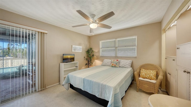 bedroom with ceiling fan and light colored carpet