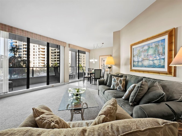 carpeted living room featuring an inviting chandelier