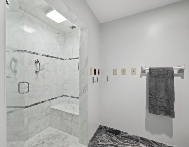 bathroom featuring an enclosed shower