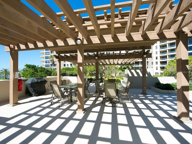 view of patio featuring a pergola and area for grilling