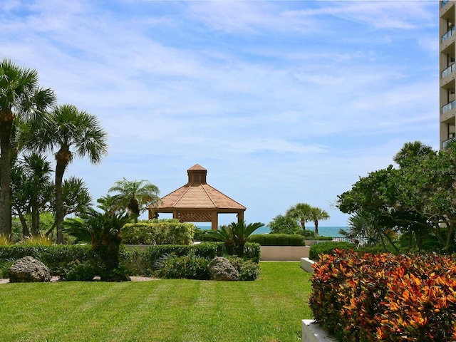 view of community with a gazebo and a yard