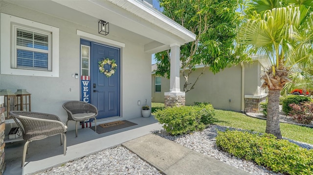 doorway to property with covered porch