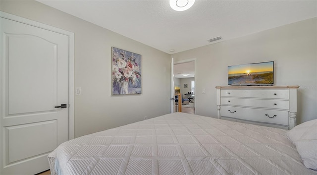 bedroom featuring a textured ceiling