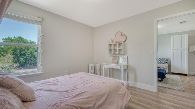 bedroom featuring light wood-type flooring