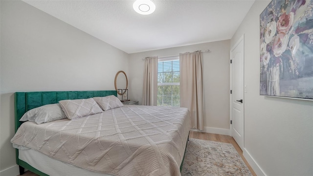 bedroom featuring wood-type flooring