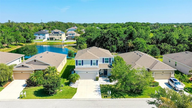 birds eye view of property featuring a water view