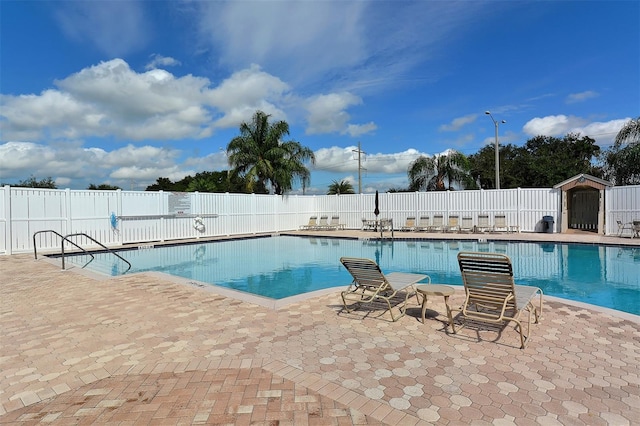 view of swimming pool featuring a patio area