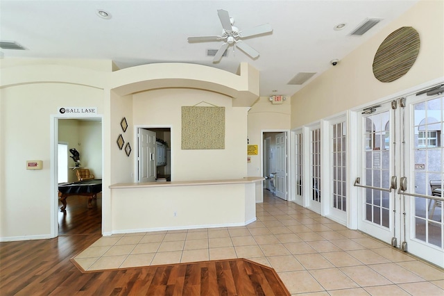 kitchen featuring ceiling fan and light wood-type flooring