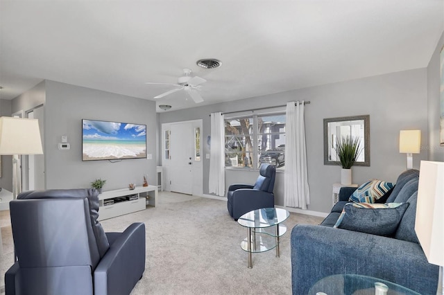 living room with carpet floors and ceiling fan