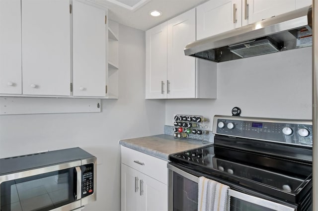 kitchen with white cabinetry and black electric range oven