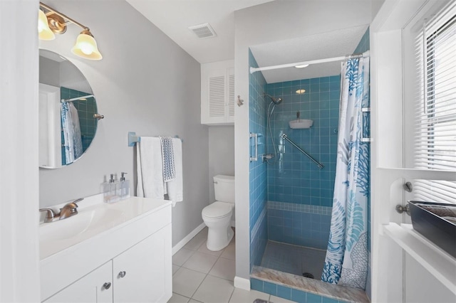 bathroom featuring toilet, tile patterned flooring, vanity, and walk in shower