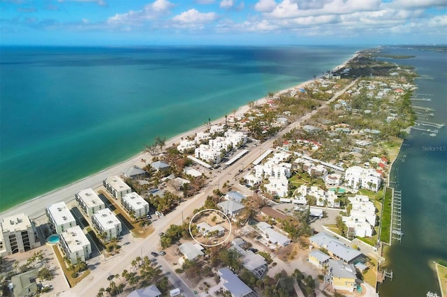 aerial view featuring a water view and a beach view