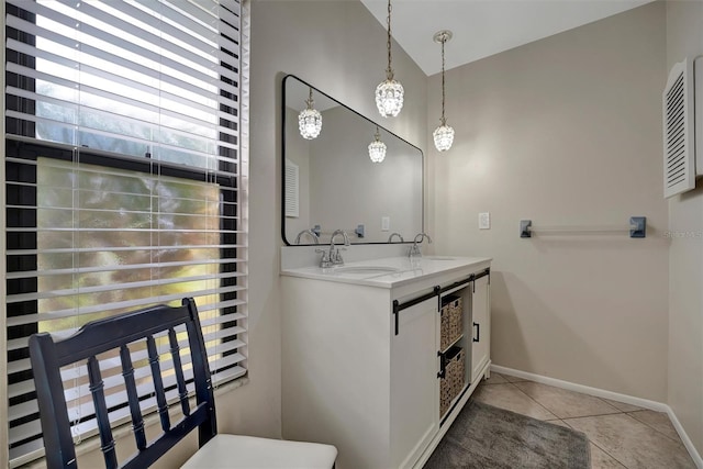 bathroom with tile patterned flooring, vanity, and lofted ceiling