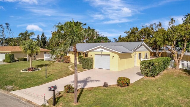 single story home with a front yard and a garage