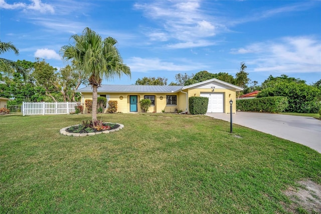 ranch-style house with a garage and a front lawn