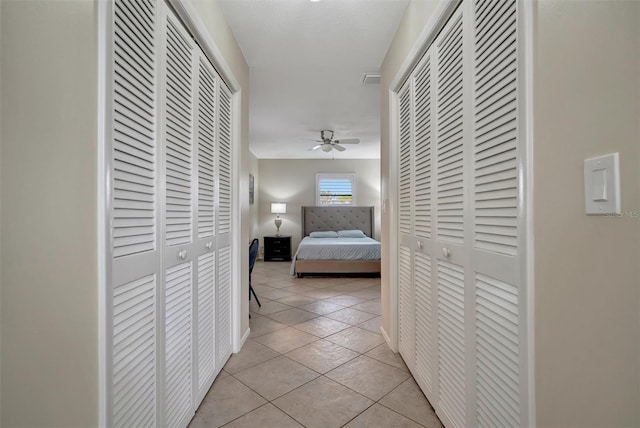 corridor featuring light tile patterned floors