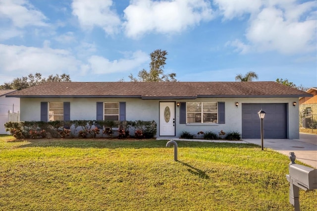 ranch-style home with a front lawn and a garage