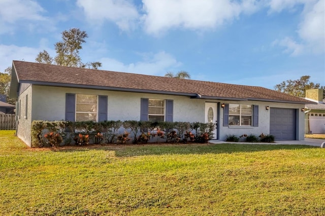 ranch-style home with a front yard and a garage