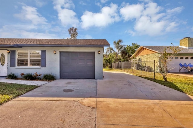 view of front facade with a garage and a front lawn