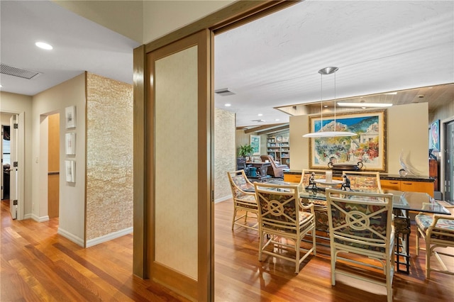 dining area with wood-type flooring