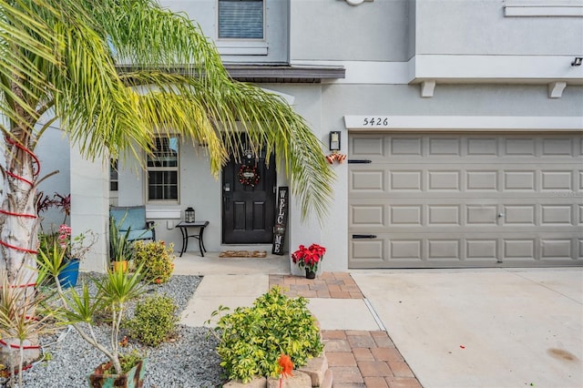 doorway to property featuring a garage