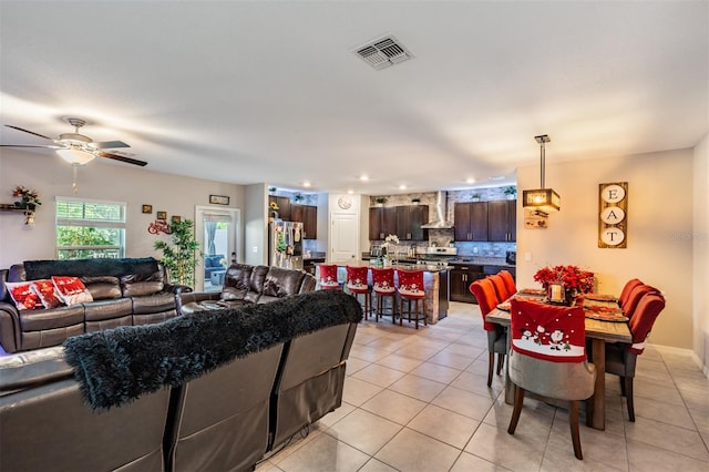 tiled living room with ceiling fan