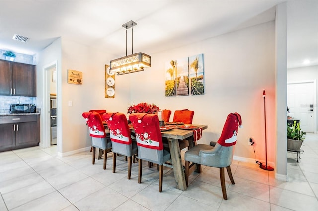 dining room with light tile patterned floors