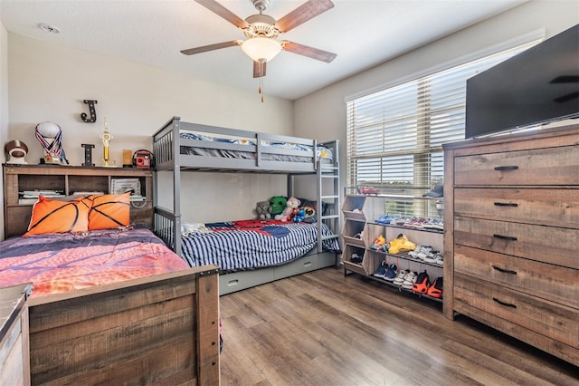 bedroom with hardwood / wood-style floors and ceiling fan