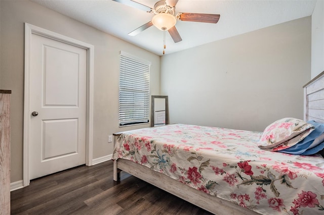 bedroom featuring ceiling fan and dark wood-type flooring