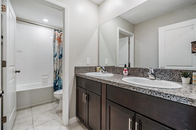 full bathroom featuring tile patterned floors, vanity, toilet, and shower / tub combo with curtain