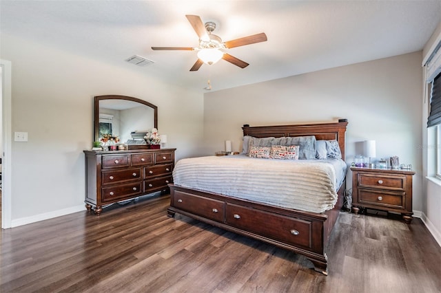 bedroom with ceiling fan and dark hardwood / wood-style flooring