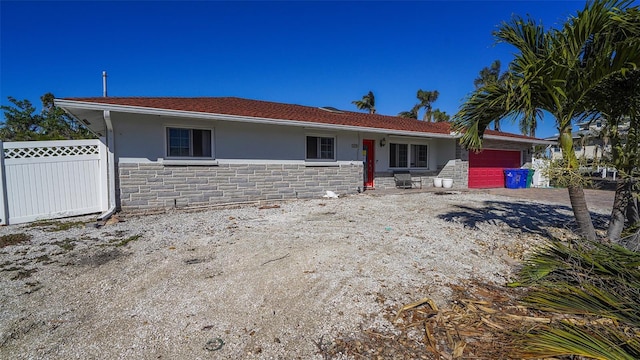 single story home featuring a garage