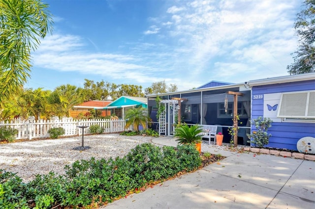 view of yard featuring a sunroom