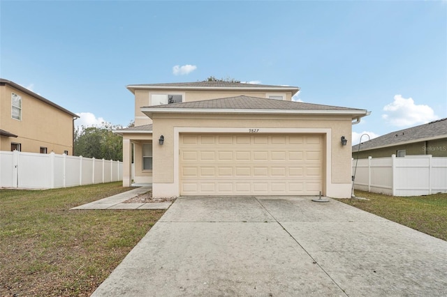 view of front of home with a garage and a front yard