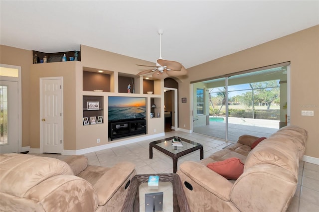 living room with ceiling fan and light tile patterned floors